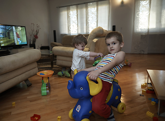 Image showing Little child playing with sister at home