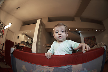 Image showing cute little baby playing in mobile bed