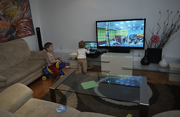 Image showing Little child playing with sister at home