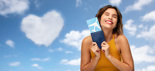 Image showing happy young woman with air ticket and passport