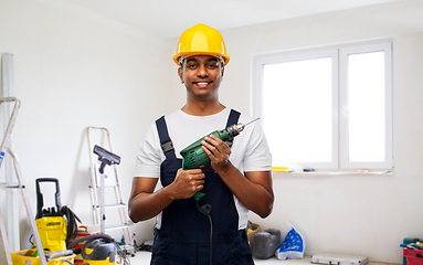 Image showing happy indian builder in helmet with electric drill