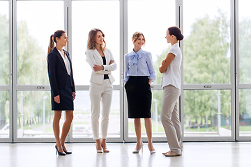 Image showing businesswomen meeting at office and talking