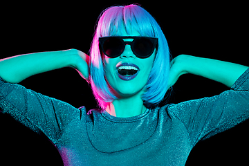 Image showing happy woman in pink wig and black sunglasses