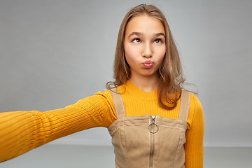 Image showing funny teenage girl taking selfie and making faces