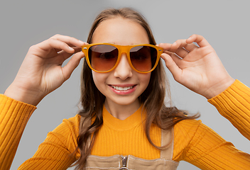 Image showing smiling young teenage girl in sunglasses