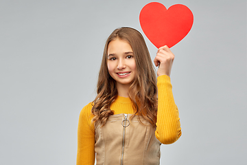 Image showing smiling teenage girl with red heart