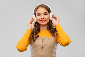 Image showing teenage girl in headphones listening to music
