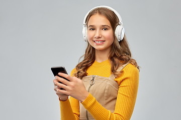 Image showing teenage girl in headphones listening to music