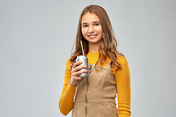 Image showing happy teenage girl drinking soda from can