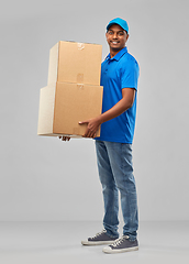 Image showing happy indian delivery man with parcel boxes