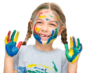 Image showing Portrait of a cute girl playing with paints