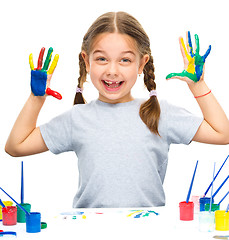 Image showing Portrait of a cute girl playing with paints