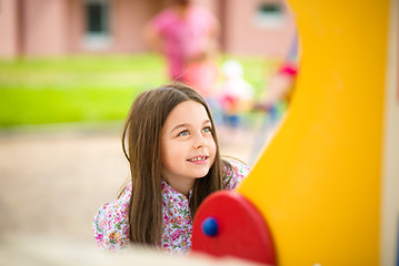 Image showing Cute little girl is playing in playground