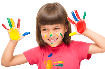 Image showing Portrait of a cute girl playing with paints