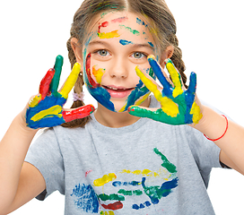 Image showing Portrait of a cute girl playing with paints