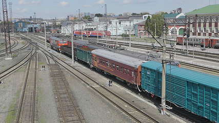 Image showing BARNAUL - AUGUST 22: Cargo red train rides on the railway station on August 22, 2017 in Barnaul, Russia