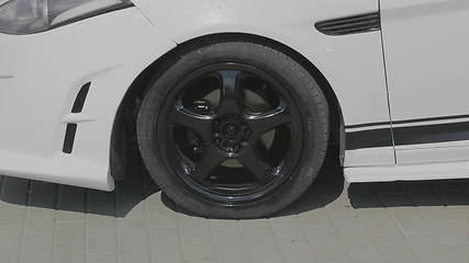 Image showing BARNAUL - AUGUST 22: Day of the city. Car wheel on the car of white color on August 22, 2017 in Barnaul, Russia