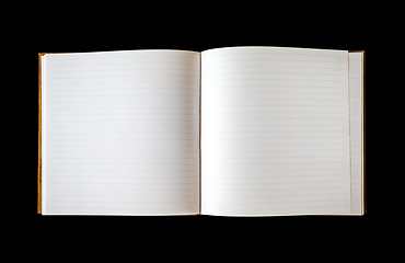 Image showing Open blank notebook isolated on black