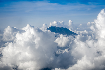 Image showing Airplane flying above Mount Agung volcano, Bali, Indonesia