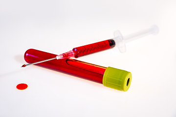 Image showing Syringe and tube with blood on white background