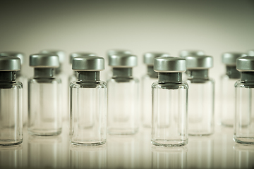 Image showing Vaccine glass bottles on grey background