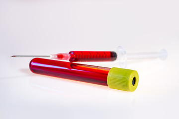 Image showing Syringe and tube with blood on white background