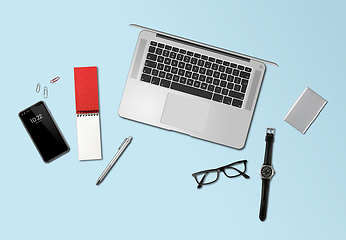 Image showing Office desk mockup top view isolated on blue