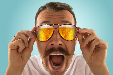 Image showing Oktoberfest man with sunglasses full of light beer