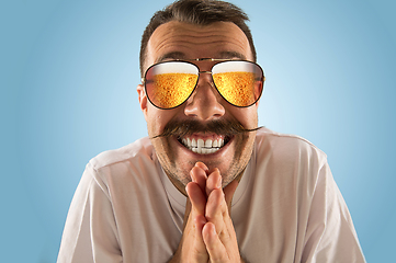 Image showing Oktoberfest man with sunglasses full of light beer