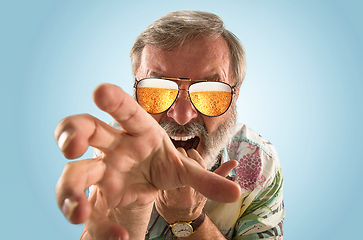 Image showing Oktoberfest senior man with sunglasses full of light beer