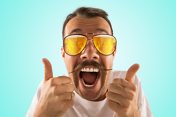 Image showing Oktoberfest man with sunglasses full of light beer