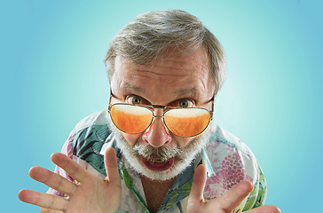 Image showing Oktoberfest senior man with sunglasses full of light beer