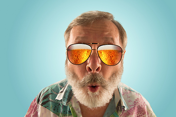 Image showing Oktoberfest senior man with sunglasses full of light beer