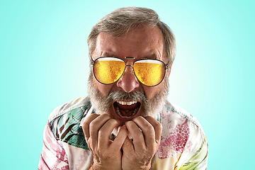 Image showing Oktoberfest senior man with sunglasses full of light beer