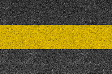 Image showing Black asphalt background texture with yellow line