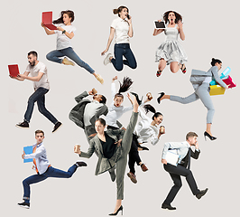 Image showing Office workers or ballet dancers jumping on white background