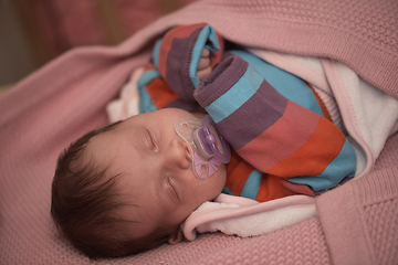 Image showing One month newborn baby sleeping in bed