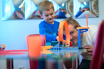 Image showing Father and children playing car toy game