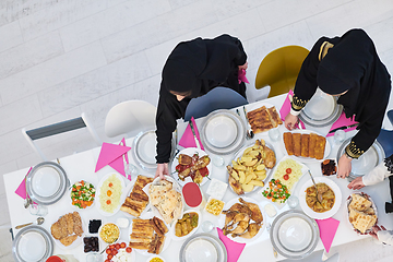 Image showing Top view of young muslim women preparing food for iftar during Ramadan