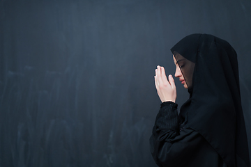 Image showing Portrait of young Muslim woman making dua