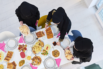 Image showing Top view of young muslim women preparing food for iftar during Ramadan