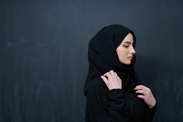 Image showing Modern young muslim woman in black abaya
