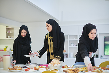 Image showing Young muslim women preparing food for iftar during Ramadan