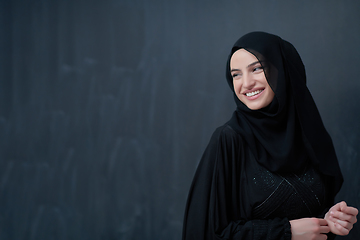 Image showing Modern young muslim woman in black abaya