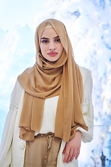 Image showing Girl wearing hijab posing on winter concept background