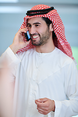 Image showing Portrait of young muslim businessman using mobile phone