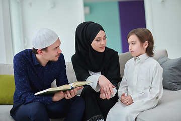 Image showing Young muslim family reading Quran during Ramadan