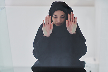 Image showing Young muslim woman doing sujud or sajdah