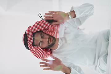 Image showing Muslim man doing sujud or sajdah on the glass floor