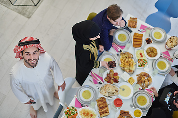 Image showing Top view of muslim family having Iftar during Ramadan holy month